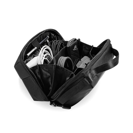 The Tech Pouch, a black organizer with multiple compartments, is open to reveal neatly arranged electronic accessories such as charging cables, adapters, and a charger for easy access while traveling.