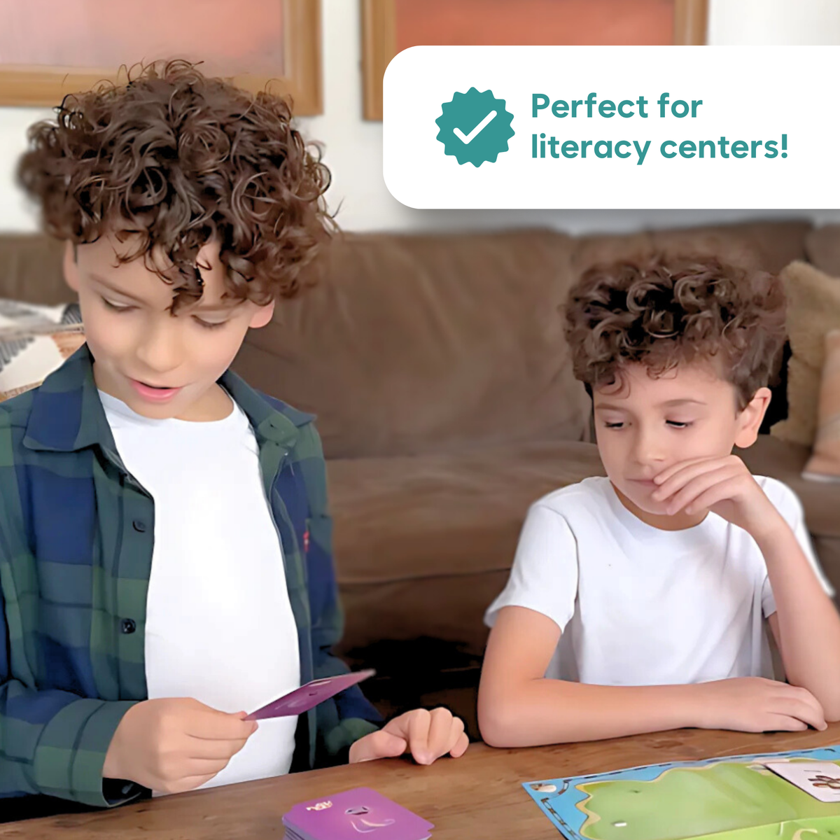 Two boys play the King Komodo Sight Words Game – CHOOSE Act Edition with cards at a wooden table, perfect for literacy centers.