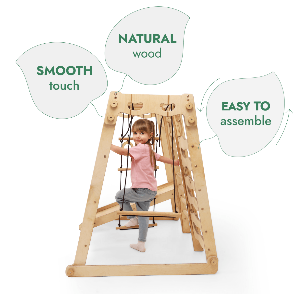 A toddler explores the 6in1 Indoor Jungle Gym, featuring smooth, natural wood and easy assembly. With a slide, swings, rope, and stairs, this indoor playset offers endless fun and safe climbing for kids.