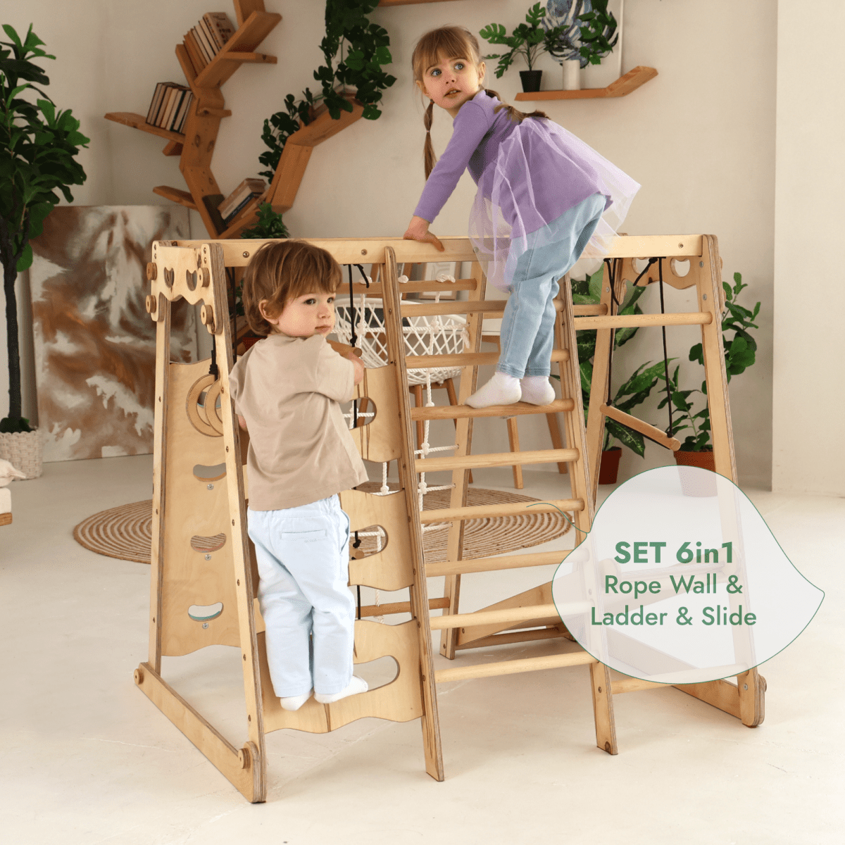 Two young children play on a 6in1 Indoor Jungle Gym for Toddler with playground, swings set, slide board, rope, and stairs in a cozy modern room decorated with plants, bookshelves, and decor items in the background.