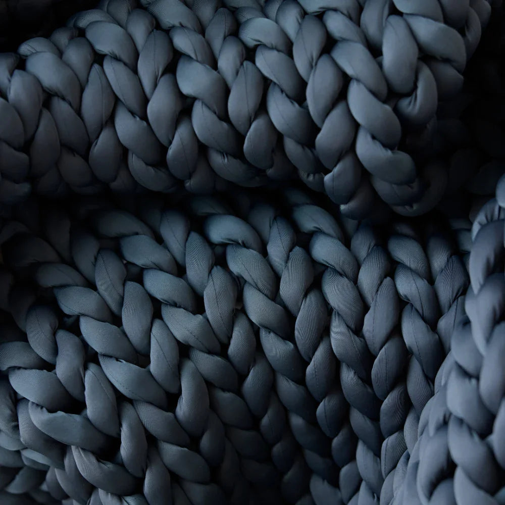 Close-up of the Ice Knit Weighted Blanket in Northern Grey, featuring thick, tightly woven yarn and a soft, textured surface—ideal as a breathable weighted blanket for cozy comfort.