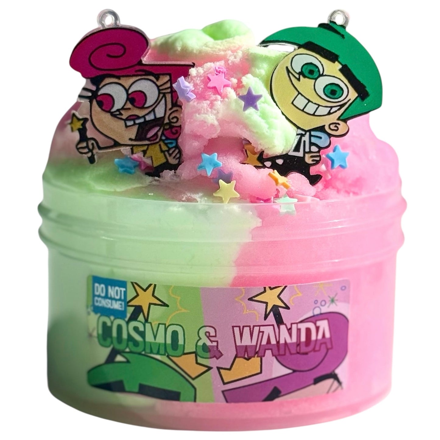 Cosmo And Wanda Cloud Cream Icee Slime 7oz features pink and green slime with cucumber melon scent, star sprinkles, and a cartoon charm. The label reads “Cosmo & Wanda” with a Do Not Consume warning—perfect for sensory play.