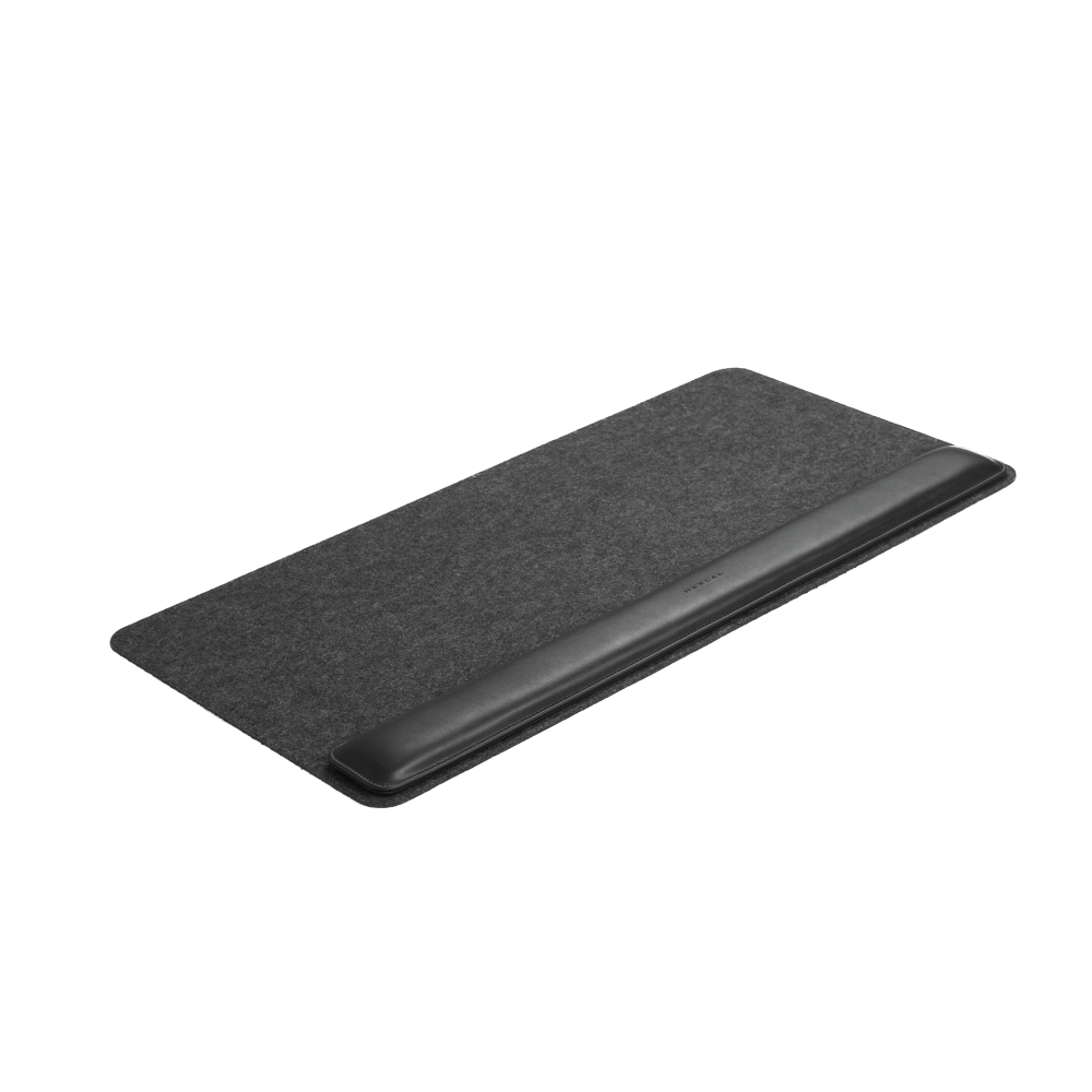 The Desk Mat Bundle features a rectangular dark gray felt mat with an integrated black vegan leather ergonomic wrist cushion, shown on a white background.