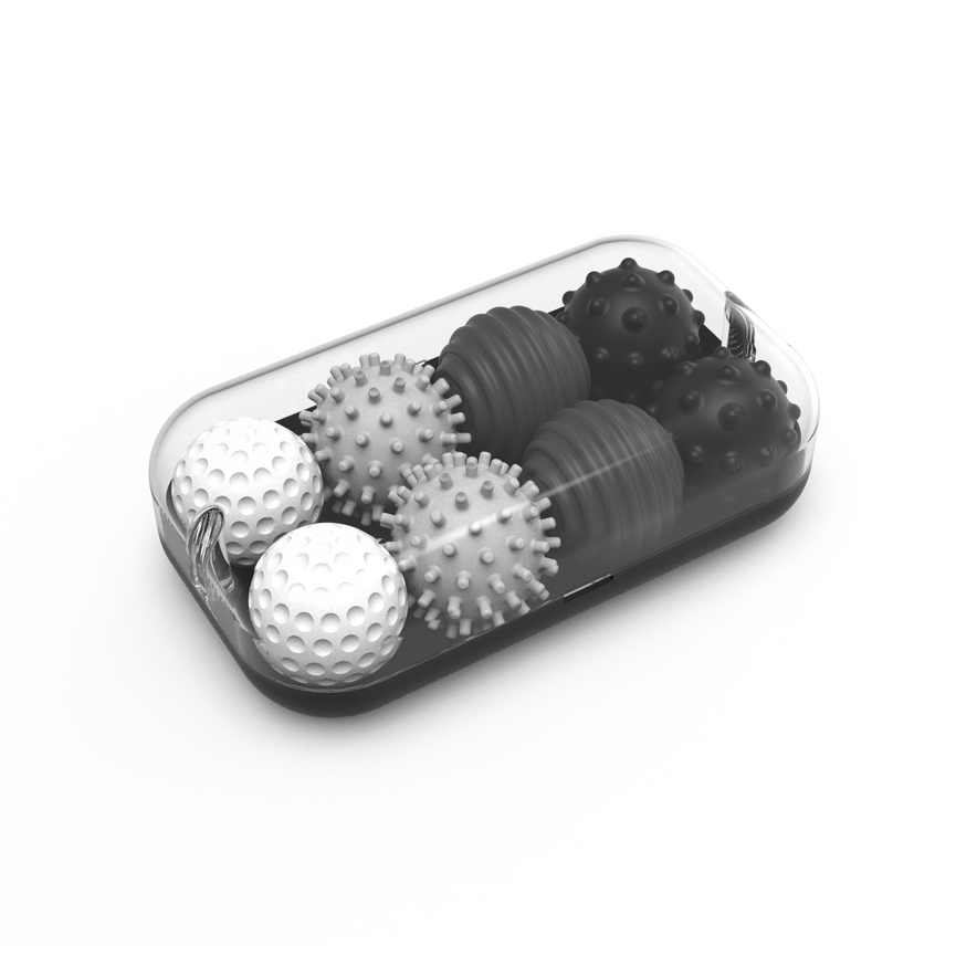 The Signets in Graphite include six textured balls—three dimpled and three spiky—arranged neatly in a transparent container, providing a satisfying fidgeting experience that aids focus.