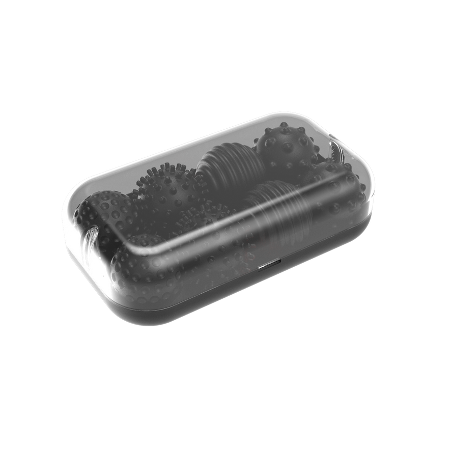 The Signets in Onyx are visible inside a transparent rectangular container with rounded edges, featuring several textured, spiky massage balls—ideal for enhancing fidgeting and improving focus.