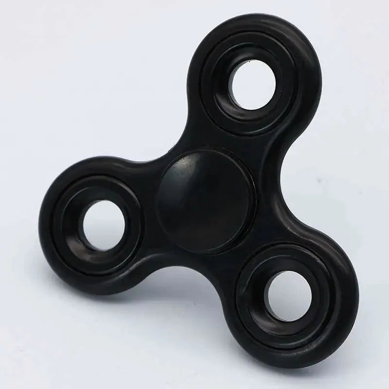 The black Premium ABS Tri-Spinner Fidget Toy for Stress Relief is ideal for all ages, featuring three arms with circular cutouts and a smooth central bearing, offering a calming spin experience on a plain white background. Perfect for autism and ADHD.
