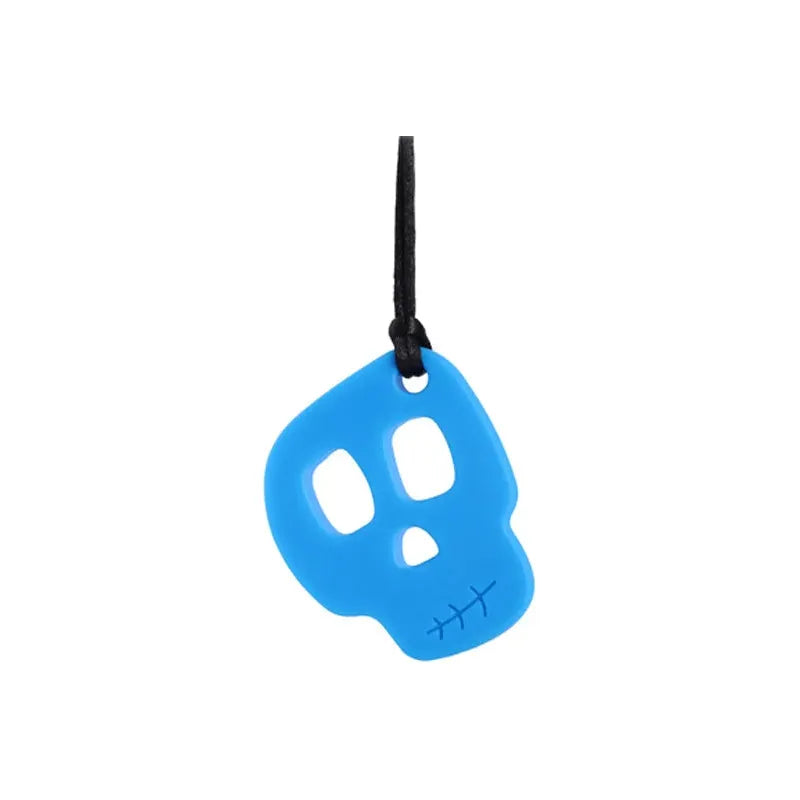 The Silicone Skull Teething Necklace is blue with a black string, featuring two large eye holes and a stitched mouth design. It doubles as a sensory chewy toy, providing teething relief for babies and support for Autism and ADHD.
