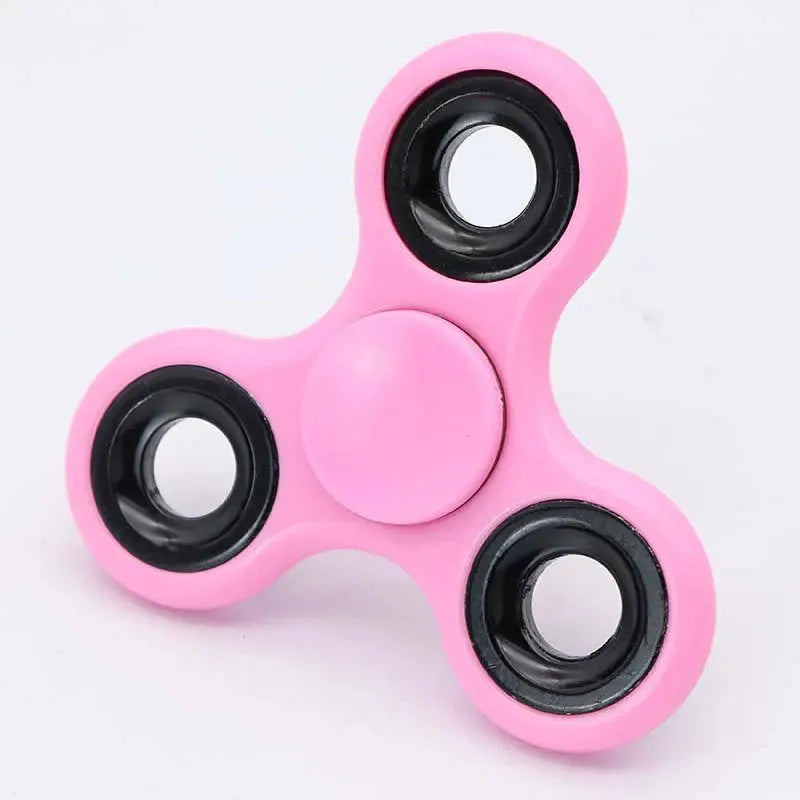 The Premium ABS Tri-Spinner Fidget Toy, ideal for stress relief and suitable for all ages, features three pink rounded arms with black bearings. Perfect for managing autism and ADHD, it rests on a white background.