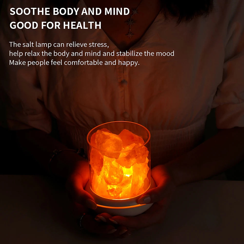 A person holds a glowing salt lamp in their hands. The text reads: Soothe body and mind with the Crystal Salt Lamp with USB Aroma Purifier & LED Multicolor Night Light. Relieve stress, relax, and stabilize your mood for comfort, happiness, and a tranquil atmosphere.