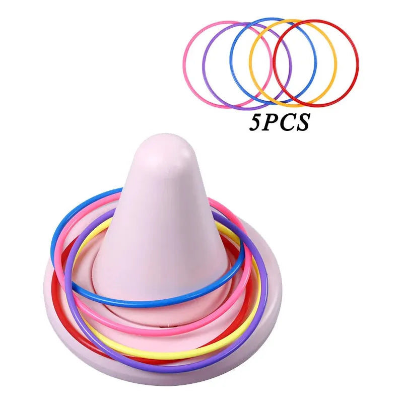 The Kids Balance Training Unicorner Chair with Throwing Ring is a fun sensory game for developing perception and coordination, featuring a colorful set of five rings in pink, blue, yellow, and purple on a white cone-shaped stand.