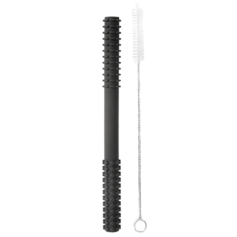 A 003-dark-grey Essential Tiny Teething Toy for Infants, featuring a textured grip, sits beside a long metal wire brush with bristles and loop handle—ideal for protecting the oral cavity and essential for baby health.