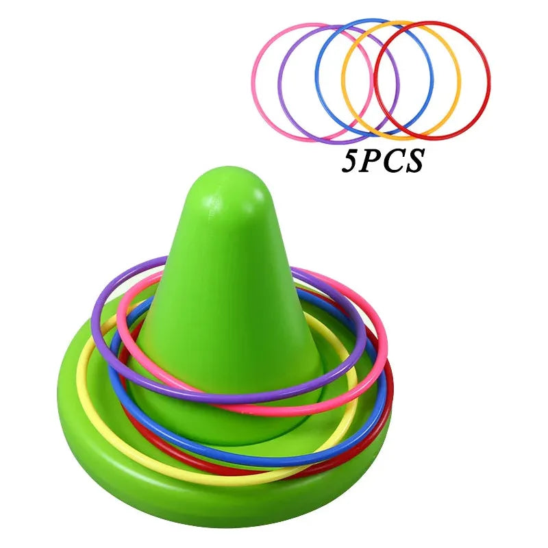 The Kids Balance Training Unicorner Chair with Throwing Ring is a fun sensory game featuring a green cone-shaped toy with rings in pink, red, yellow, purple, and blue. An image shows the five rings separately near 5PCS, perfect for enhancing childrens perception and coordination skills.