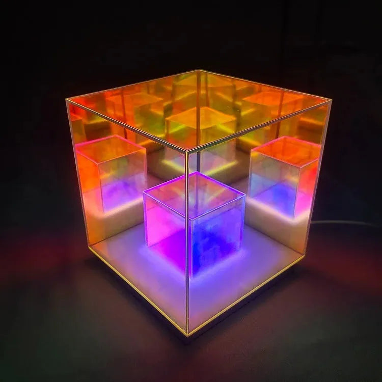 The Vibrant RGB LED Night Light for Parties and Home Décor is a versatile table lamp featuring illuminated nested cubes with reflective surfaces. It displays vibrant red, orange, yellow, and purple colors using dynamic RGB lighting for an illusion of depth.