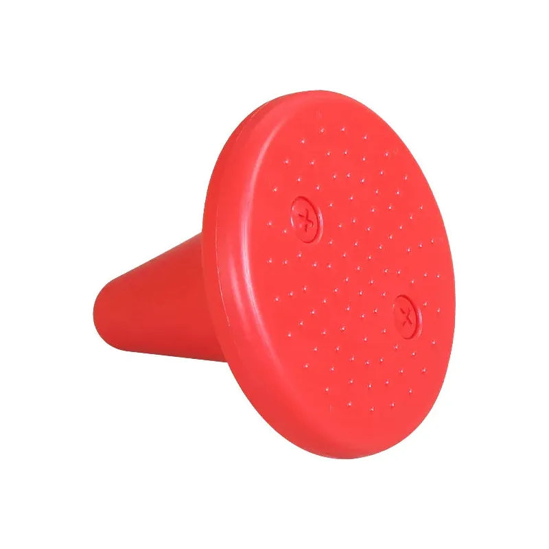 The Kids Balance Training Unicorner Chair with Throwing Ring is a red plastic cone featuring small dots and two circular designs. Perfect for developing perception and coordination in children, this sensory toy stands on its wide, flat surface.