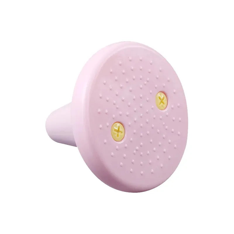 The Kids Balance Training Unicorner Chair with Throwing Ring is a fun sensory game in pink, featuring a round object with a flat textured front, two yellow screw-like shapes, and a tapered back similar to a stopper, perfect for enhancing childrens balance and coordination.