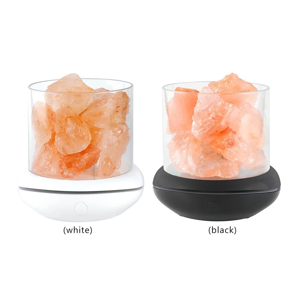 The Crystal Salt Lamp with USB Aroma Purifier & LED Multicolor Night Light boasts pinkish-orange crystals in clear cylinders on white and black bases. With front buttons for control, these enhance any bedroom’s ambiance while purifying the air.