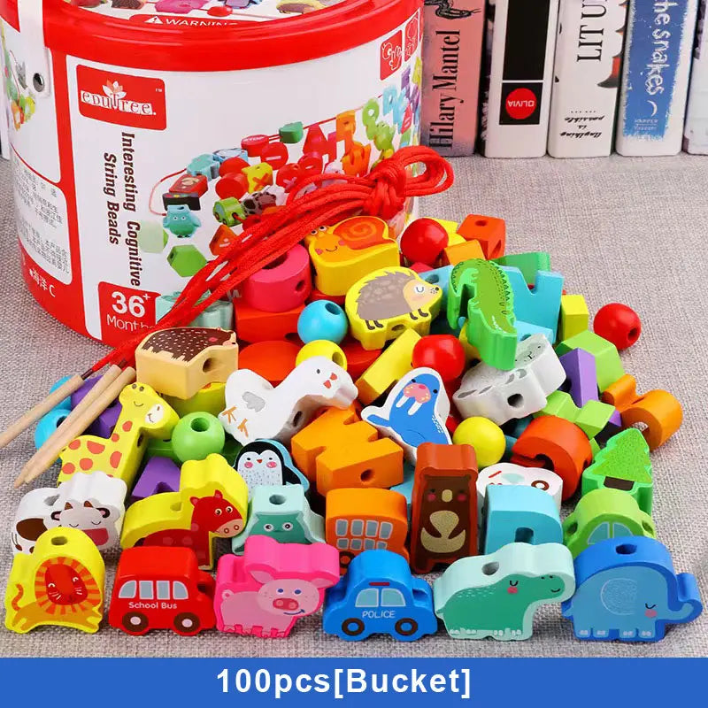 This 100PCS Bucket B set of Wooden Beaded Toys features vibrant beads in fruit, vegetable, animal, and vehicle shapes. Designed for childrens early education, the toys are crafted from safe materials and include a red string; containers are visible in the background.