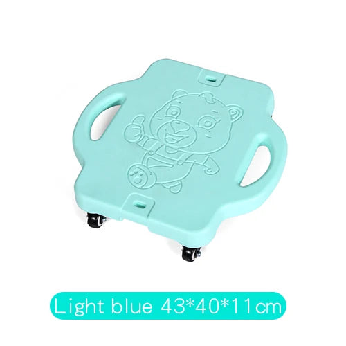The Kids Sensory Balance Board is a light blue (#ADD8E6) four-wheeled skateboard, featuring side handles and a cartoon bear design. Its perfect for developing motor skills through fun play and sensory training. Dimensions: 43x40x11cm.
