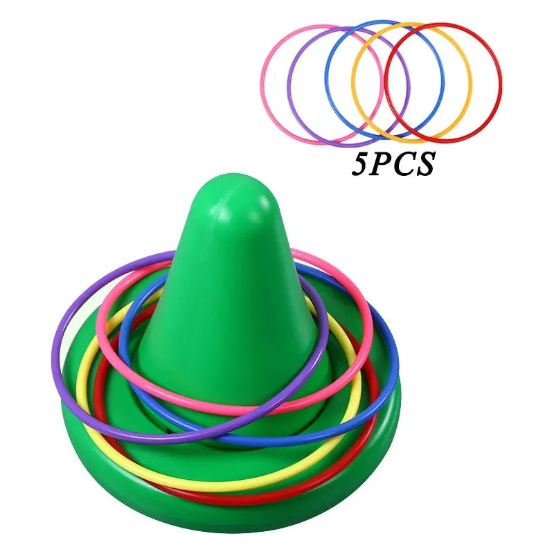 The Kids Balance Training Unicorner Chair with Throwing Ring is a sensory game for developing perception and coordination. It features a green cone with multicolored rings, including five pieces in pink, red, blue, yellow, and purple.
