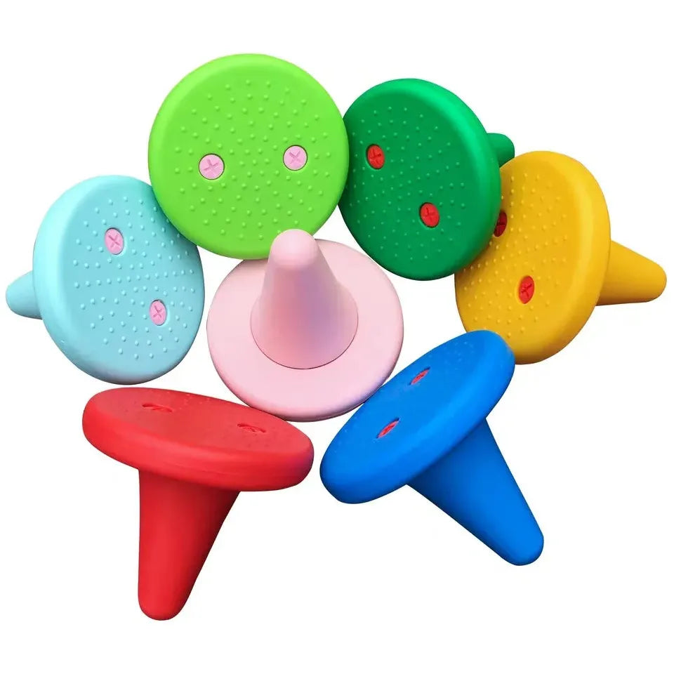 The cone-shaped objects of the Kids Balance Training Unicorner Chair with Throwing Ring feature vibrant colors like red, blue, and yellow. Each top has two circular grooves resembling abstract eyes—perfect for childrens perception and coordination training.