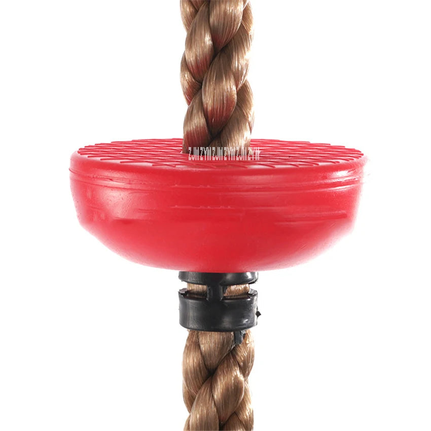 The Outdoor Adventure Climbing Ropes for Kids features a thick brown rope with a red PE disc swing seat and black plastic connector for safety. Its textured surface offers grip and supports physical development, perfect for sensory play and outdoor adventures. The image shows its children-inspired design.
