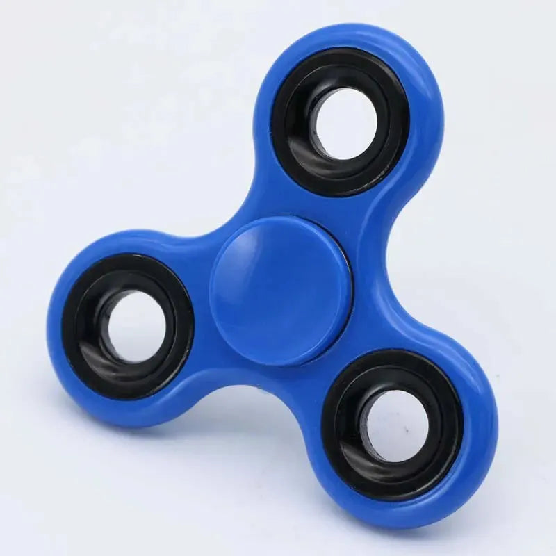 A blue Premium ABS Tri-Spinner Fidget Toy with three rounded arms and black circular bearings rests on a white background, designed for stress relief and support for autism and ADHD.