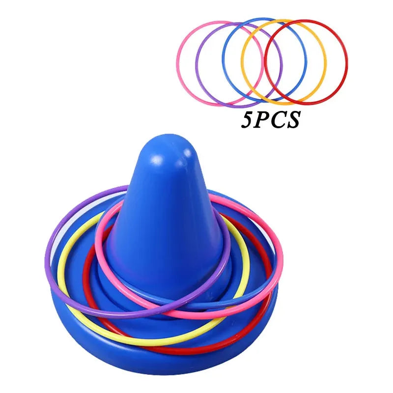 The Kids Balance Training Unicorner Chair with Throwing Ring, featuring colorful pink, purple, yellow, and red rings encircling a blue cone, is a lively sensory game aiding childrens perception and coordination. Includes five additional rings labeled 5PCS.