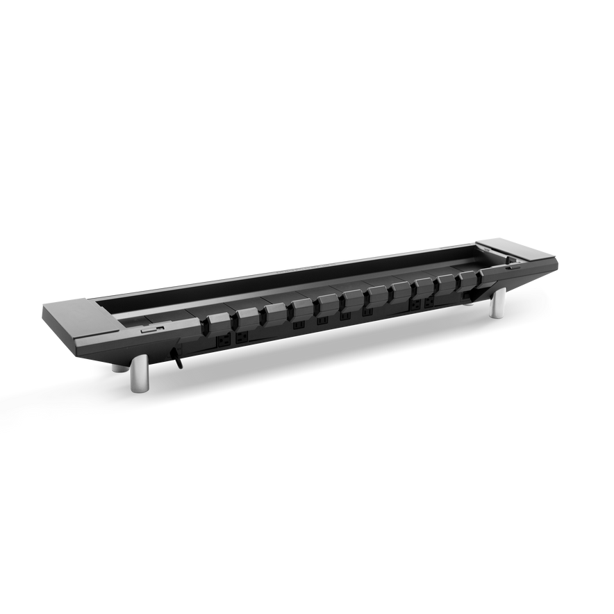 The Hexcal Studio™ is a long black power strip with multiple outlets and a cable, elevated on two silver legs for efficient cable management, displayed against a plain white background.