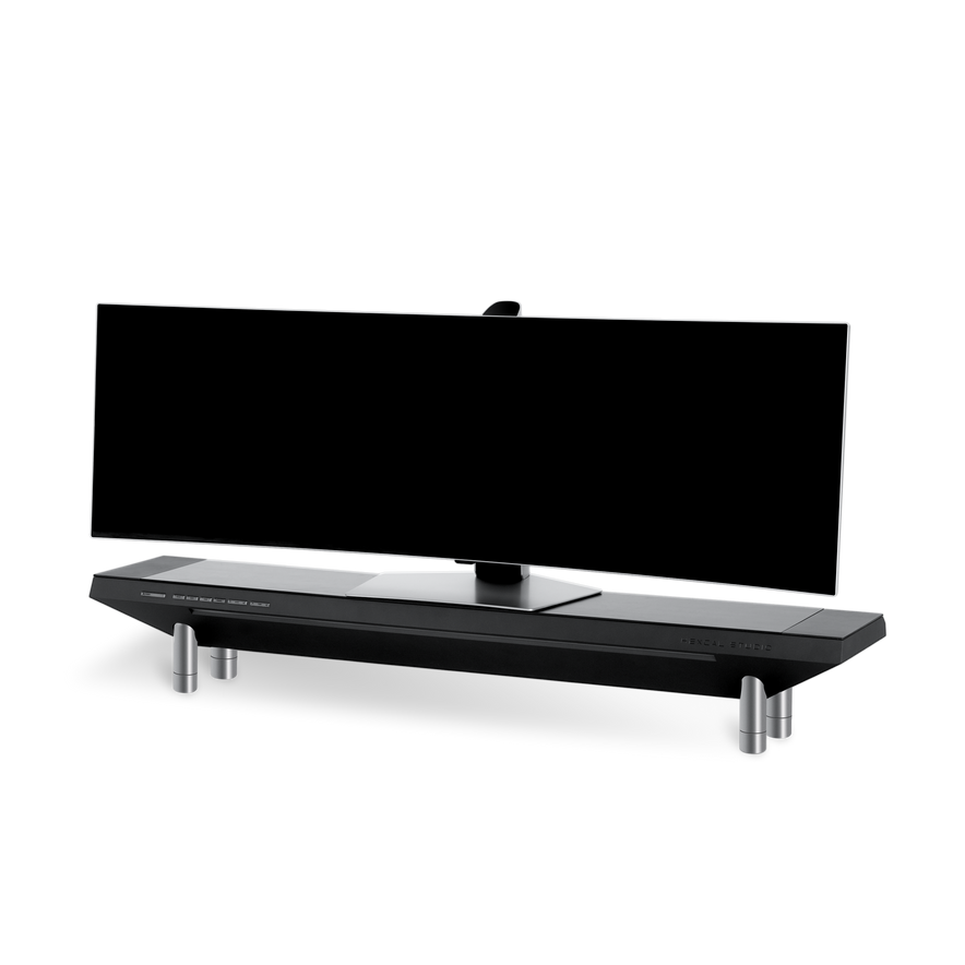 The Hexcal Studio™ is a wide, curved black monitor with a sleek, angular adjustable stand on four metallic cylindrical legs, displayed against a plain white background.