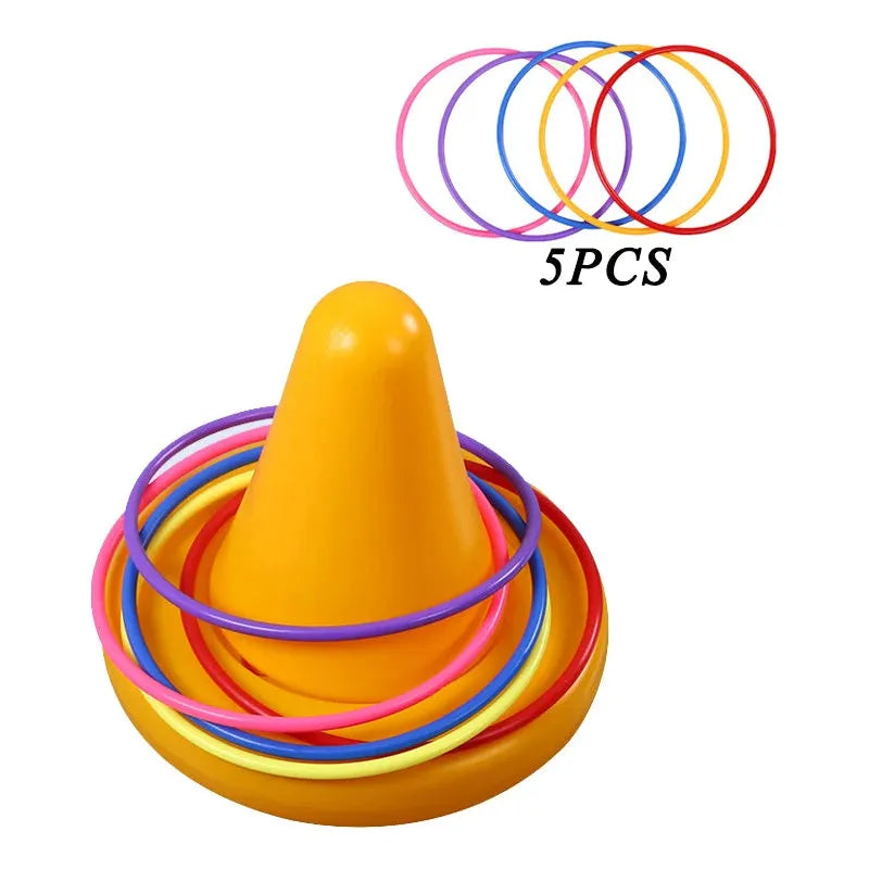 The Kids Balance Training Unicorner Chair with Throwing Ring is a fun sensory game featuring a yellow cone and five colorful rings (pink, purple, blue, yellow, red), ideal for enhancing motor skills through interactive play. 5PCS indicates five rings are included for balance training and coordination development.