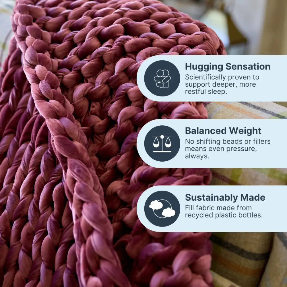 A close-up of the Velvet Weighted Blanket, a chunky woven mauve throw draped on a couch. Overlaid text features its cozy comfort, gentle hugging sensation, balanced weight, and eco-friendly fabric from recycled plastic bottles.