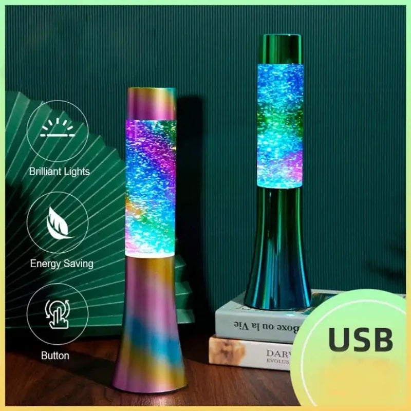 Two Color-Changing LED Glitter Lava Lamps, vibrant 13-inch novelty night lights for parties and home decor, light up a dim room. One sits strikingly on a closed book. Icons highlight features: brilliant lights, energy efficiency, and a button with the prominent USB label.