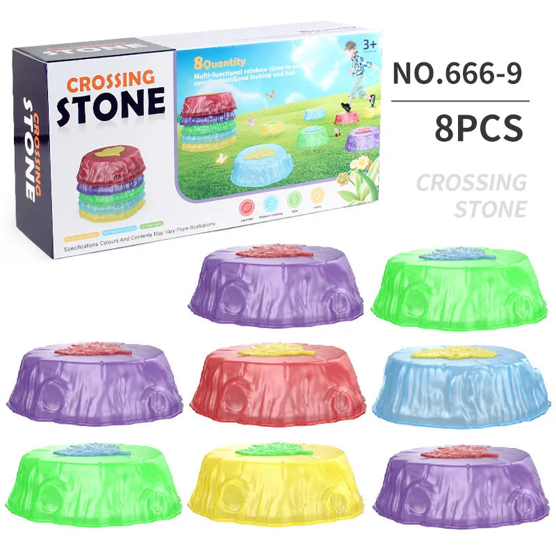 The Crossing Stone box showcases vibrant Rainbow Luminous Balance Stones for Kids, ideal for outdoor sensory play training. This set of 8 pieces (product number 666-9) features colors like purple, red, green, blue, and yellow and is designed for ages 3 and up.