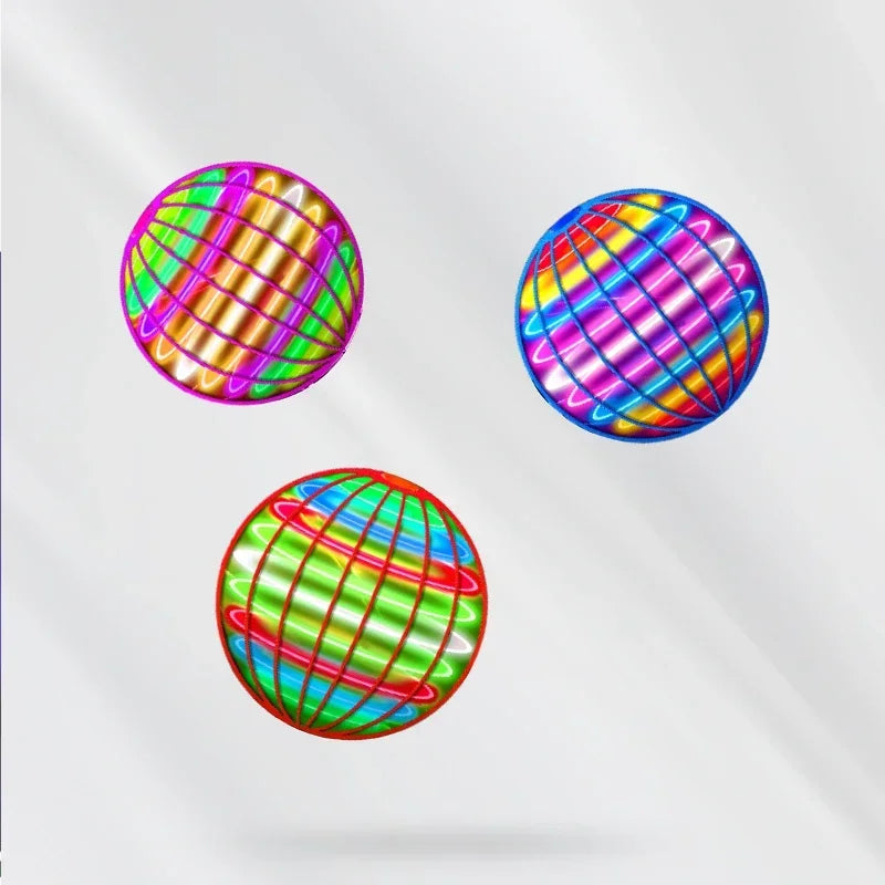 Three vibrant, glowing Magic Flying Ball Mini Toys with neon grid patterns float against a white background. These automatic obstacle-avoidance UFO boomerang spinners feature distinct colors and cast soft shadows—perfect for adults and kids as Christmas gifts.