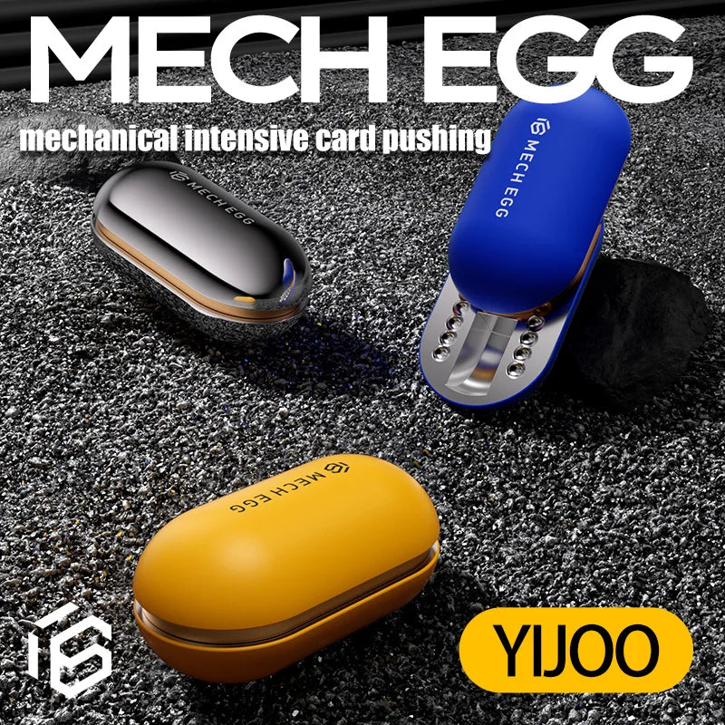 Three Mech Egg EDC Fidget Slider toys in yellow, blue, and metallic silver are displayed on a black textured surface, showcasing this metal stress relief and anti-anxiety tool by YIJOO—ideal for adults with ADHD or at the office.
