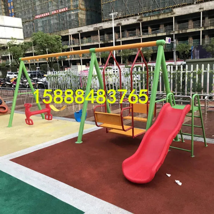 A vibrant playground includes a red slide, metal ride-on toy, two swings, and climbing bars on safety mats. Unisex for ages 3-8, its framed by construction and trees with a bold number. Featuring childrens swings, climbing nets, swinging bridges from the outdoor toys range.