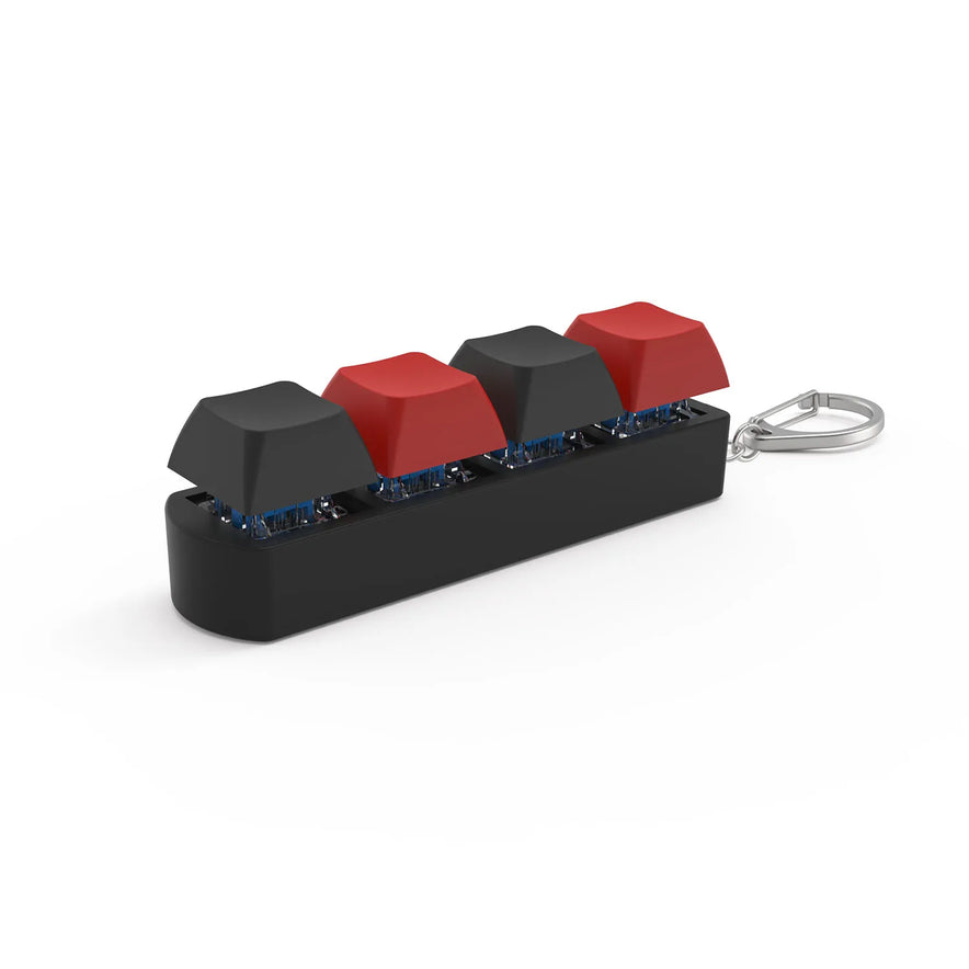 The 4Keys Finger Button Anti Stress Toy is a compact black and red keychain with four mechanical keyboard keycaps—ideal office decompression gifts for kids and adults, offering portable stress relief anywhere.