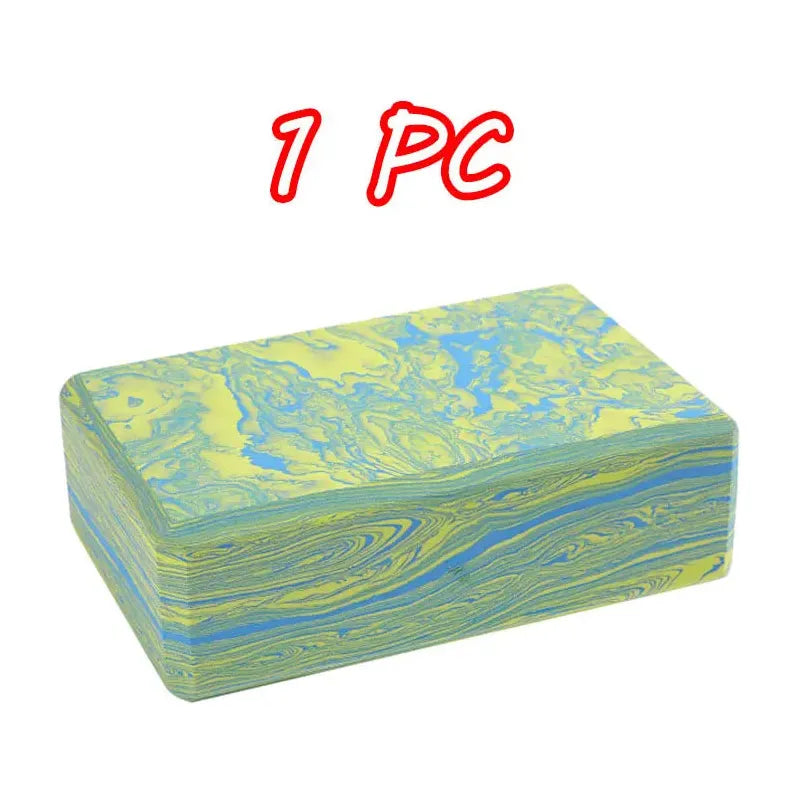 A rectangular soap bar with marbled blue and yellow swirls, reminiscent of Montessori Sensory Balance Stones. The text 1 PC is written in red above it.