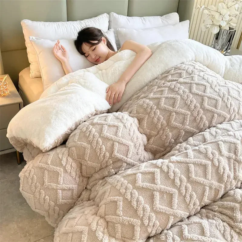 A person sleeps in a cozy bed wrapped in a Luxurious Artificial Cashmere Weighted Blanket for Ultimate Winter Comfort. Resting on white pillows with a soft headboard and flowers on the bedside table, the room feels calm and inviting, creating the perfect sanctuary for restful sleep.