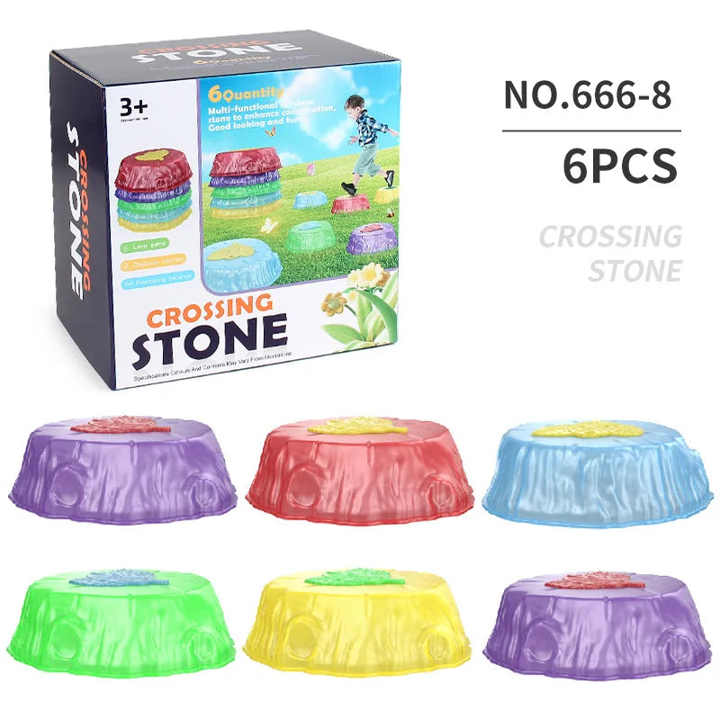 Box of six Rainbow Luminous Balance Stones for Kids, designed for outdoor sensory play and balance training. Suitable for ages 3 and up, these vibrant stones come in purple, pink, blue, green, yellow, and red. The box shows the stones being used playfully outdoors.