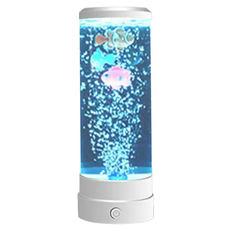 The Enchanting Bubble Fish Night Light Aquarium Lamp boasts a cylindrical design with floating colorful fish, bubbles, and a vibrant blue background. Its white base has a power button, while color-changing lights enhance the realistic aquarium ambiance for home or café décor.