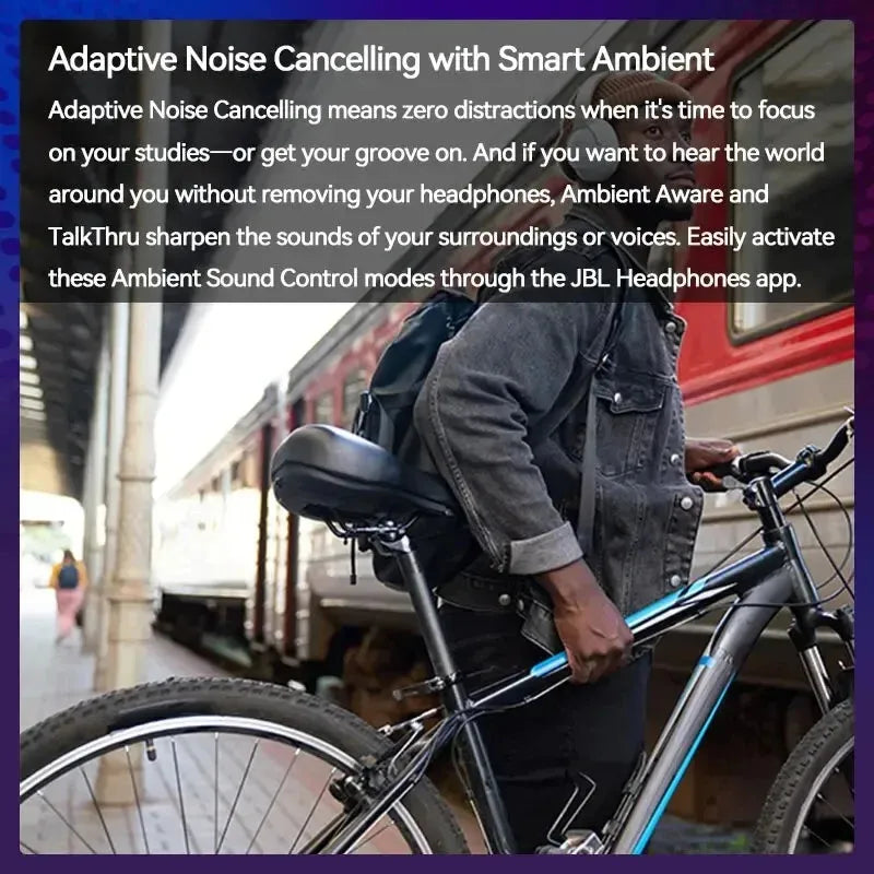 A person with a backpack holds a bicycle by a train platform, displaying JBL T770NC Bluetooth Headphones. With advanced noise cancellation allowing ambient sound without removal, all controllable via the app, a red train stands ready for departure in the background.