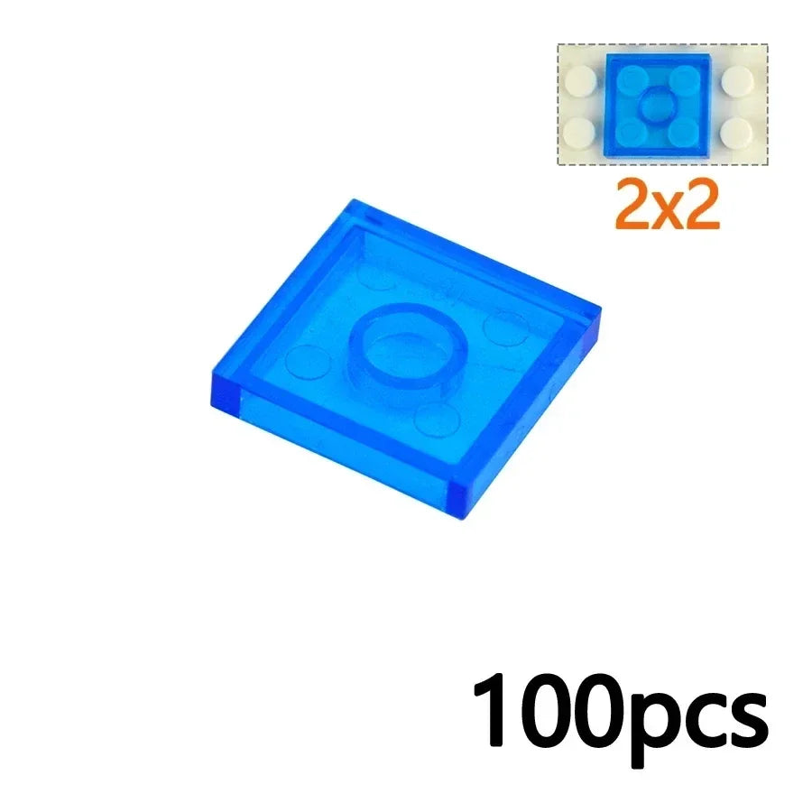 A MOC Transparent Bulk Brick Set in 3068-Clear Blue, featuring 1x1, 1x2, 1x4, and 2x4 LEGO-compatible clear building blocks. 100pcs appears at the corner—ideal for expanding your wall panel or house parts collection.