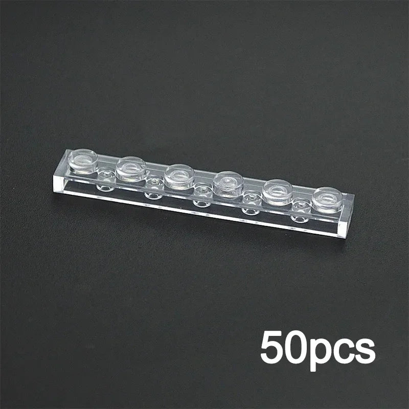 A transparent rectangular 1x6 building block panel (compatible with Lego), shown on a black surface. The text 50pcs is in white at the bottom right—ideal for organizing or displaying your MOC Transparent Bulk Brick Set.