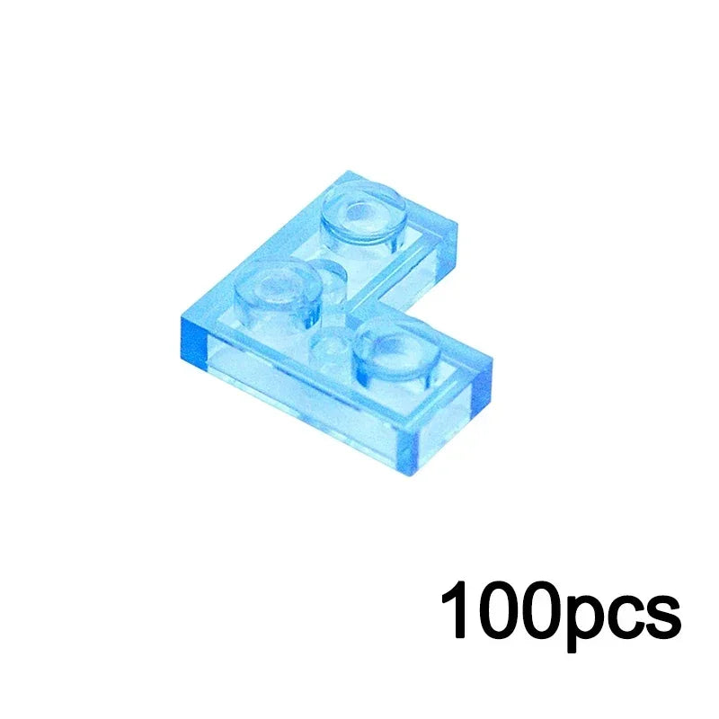 A transparent L TRN light blue MOC bulk brick (various sizes) compatible with Lego is shown on a white background. 100pcs—perfect for expanding your building block collection appears in the lower right corner.