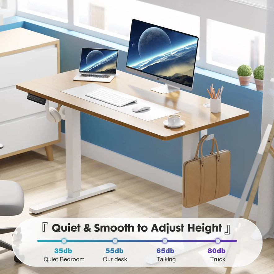 Create a modern home office with the JHK Electric Height Adjustable Standing Desk, a 40x24-inch ergonomic sit-stand workstation featuring spaces for a monitor, laptop, keyboard, mouse, and side bag. It includes a height-adjustable control panel with sound levels between 35dB and 80dB.
