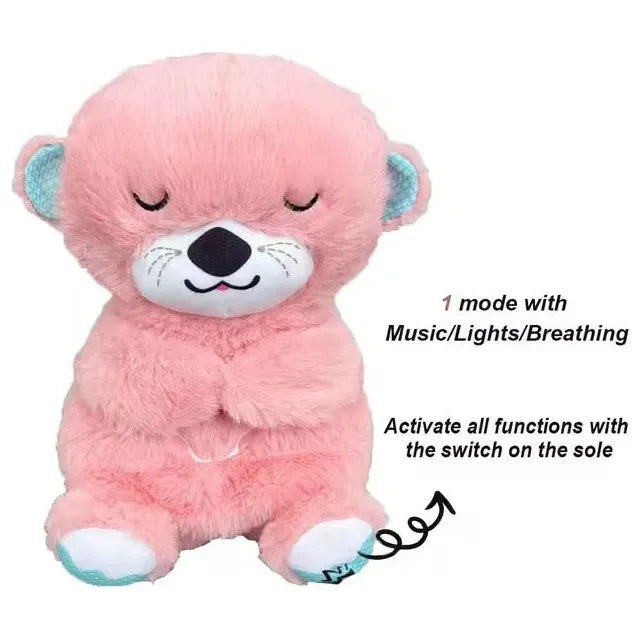 A pink otter plush toy with closed eyes and a smiling face sits upright. Text reads, 1 mode with Music/Lights/Breathing and Activate all functions with the switch on the sole, pointing to its foot. Ideal as a Musical Breathing Otter Plush Toy for newborn comfort and sensory play.