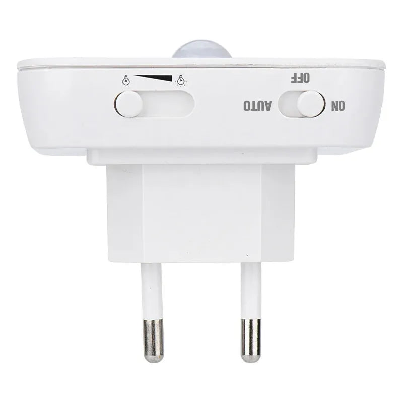 A white Dimmable Motion Sensor LED Night Light with an EU plug features a two-prong plug, slider for light intensity, and auto/off/on switch. Its energy-efficient design offers adjustable automatic or manual operation, ideal for a babys room, bedroom, or corridor.