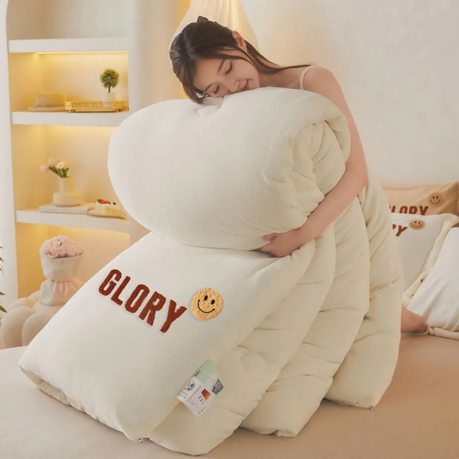 A person snuggles into the KDJEIKZ Ultra Cozy Winter Weighted Blanket, a large milk velvet comforter, feeling its warmth and luxury with GLORY and a smiley face on it. The softly lit room, with shelves and cushions, enhances the cozy atmosphere.