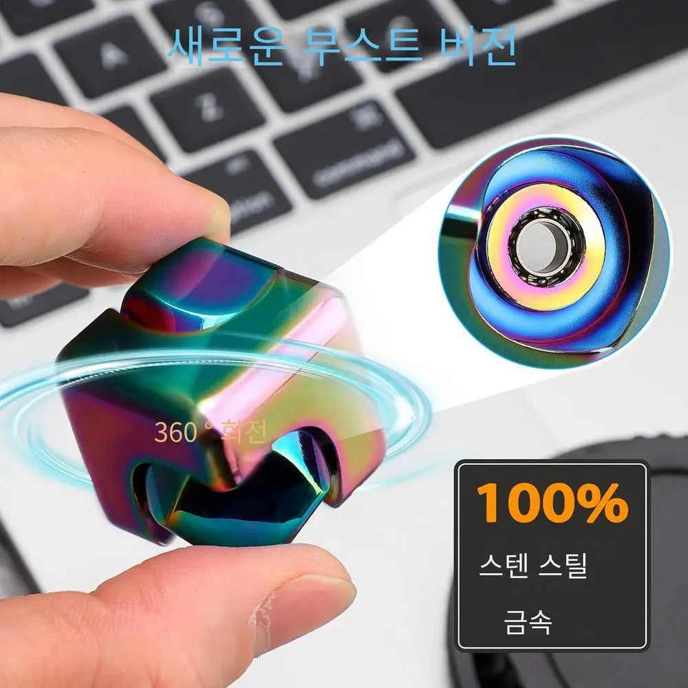 A hand holds the Infinity Gear Cube Spinner, a multicolor antistress toy made in Mainland China near a laptop. Korean text highlights features like 100% stainless steel and 360° rotation.